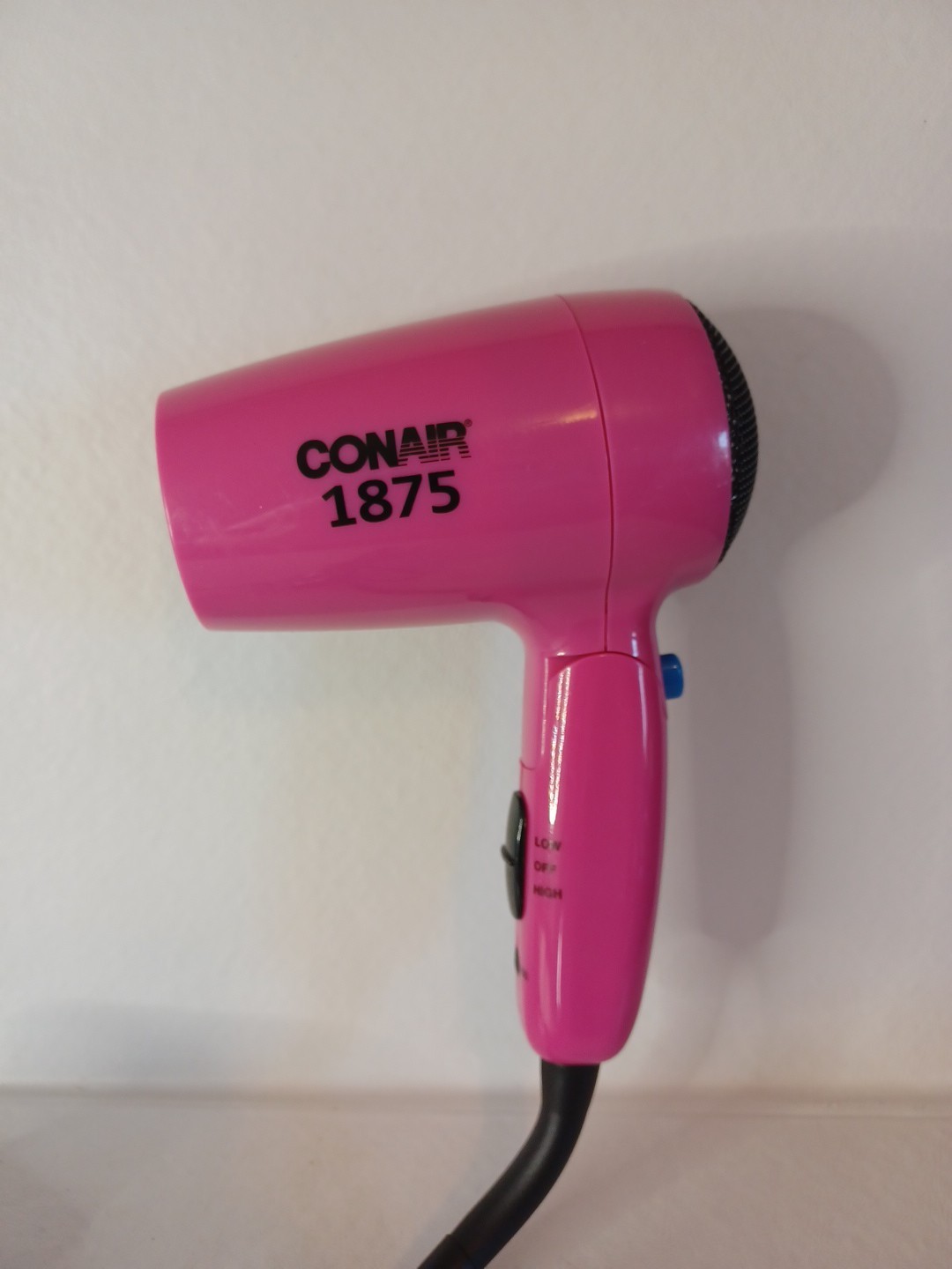 Conair folding hairdryer in a jaunty pink color